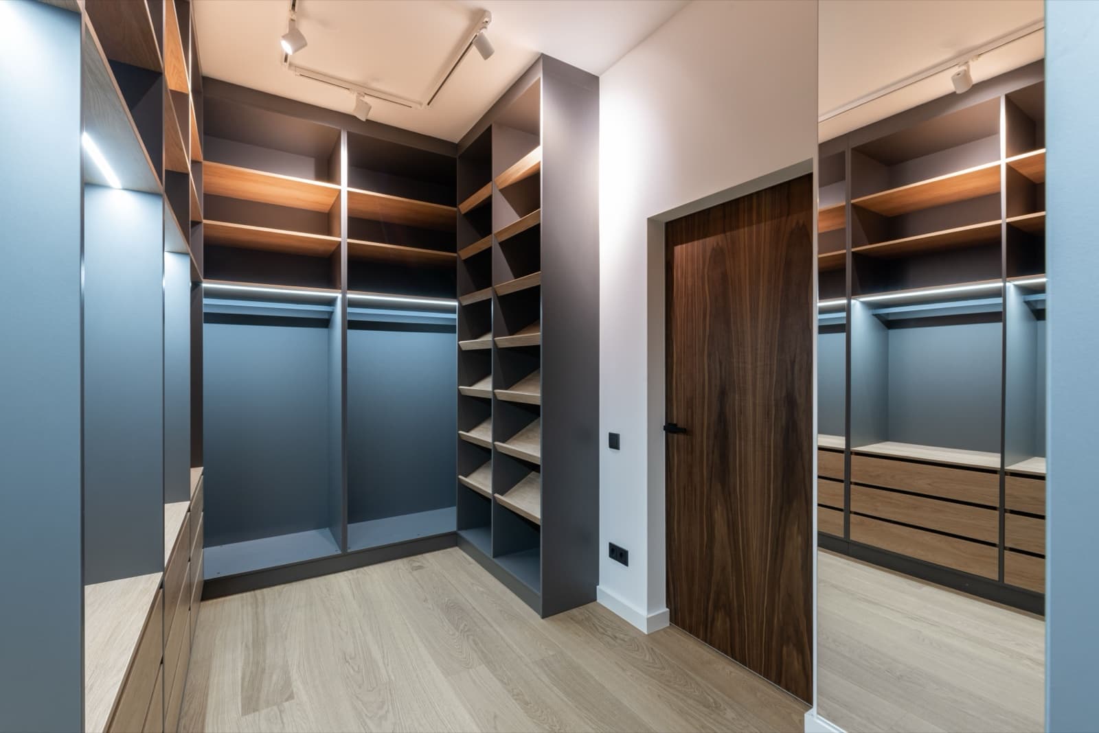 Finished walk-in wardrobe with custom built-in shelving and drawers